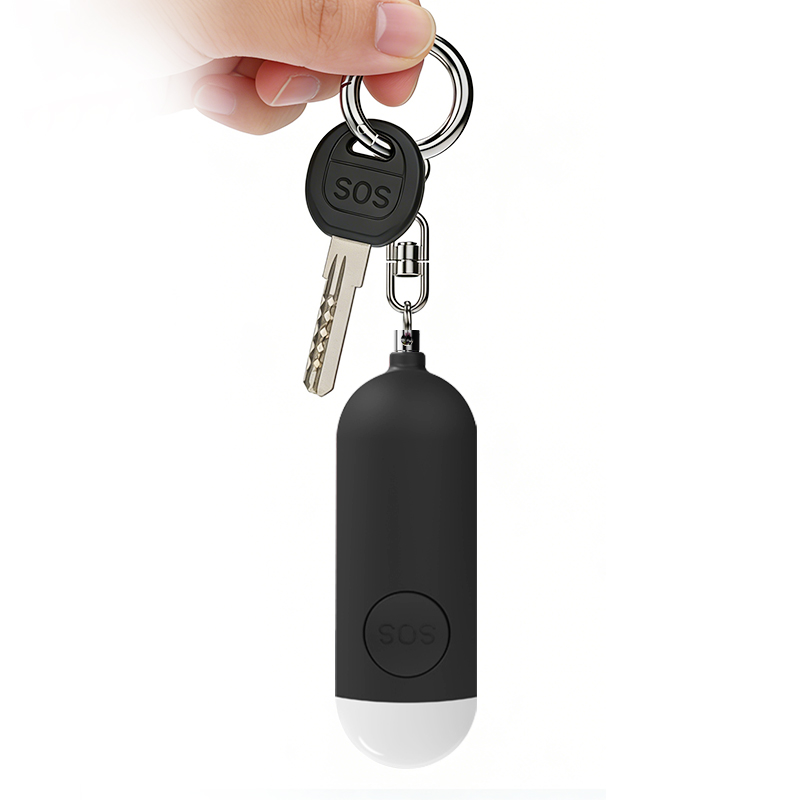 Alarma personal negra colgada junto a unas llaves